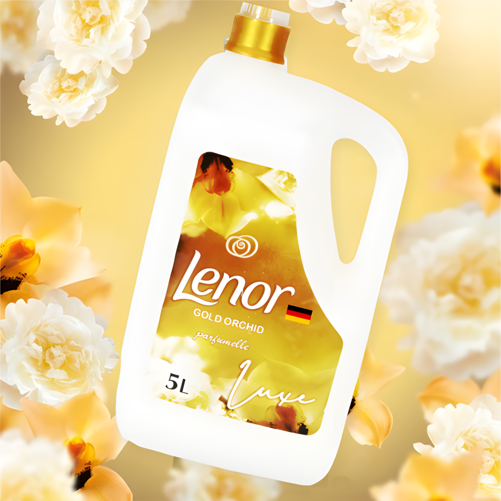 Close-up of a white laundry detergent bottle with a gold cap, label showing Lenor Gold Orchid, surrounded by pale yellow flowers.